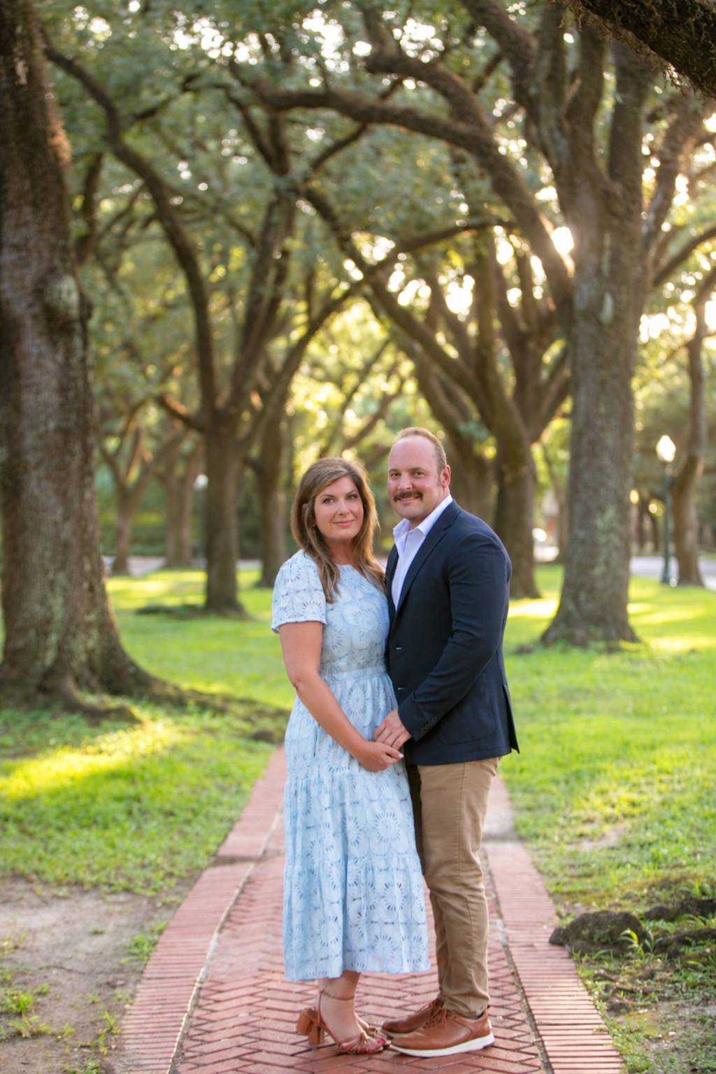 Erin and Isaac beneath the oak trees